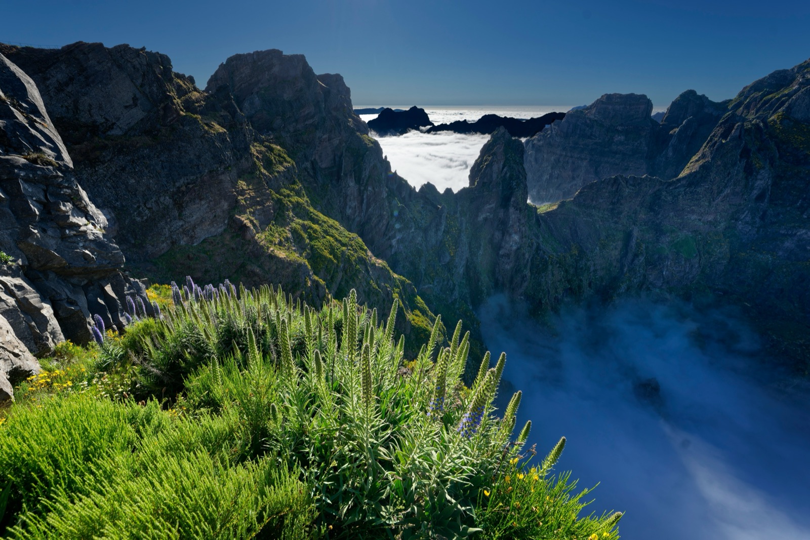 A Madeira mountain ridge with foggy valleys, atmospheric and quiet.