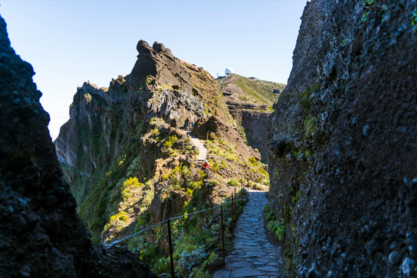 A stone path winding along the Pico Areeiro hiking trail in Madeira.