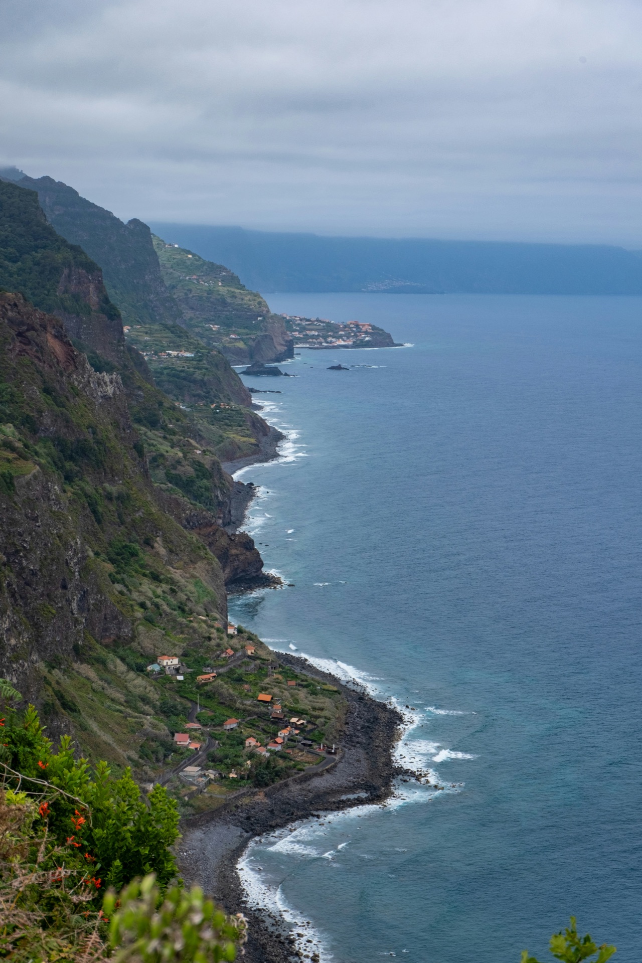 Madeira's volcanic coastal cliffs meeting the Atlantic, photographed in golden light.